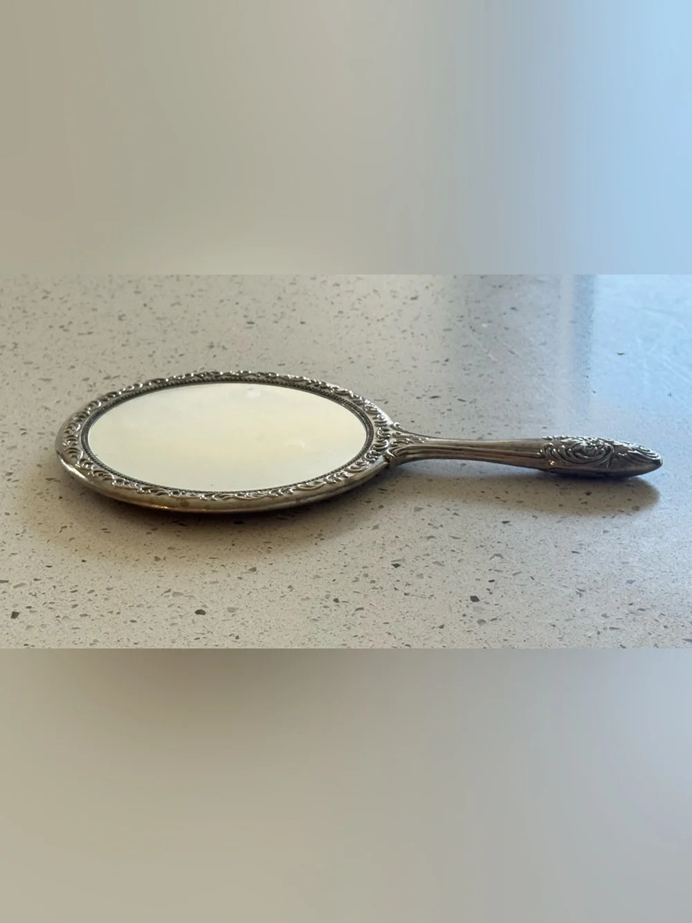 vintage silver-plated vanity hand mirror